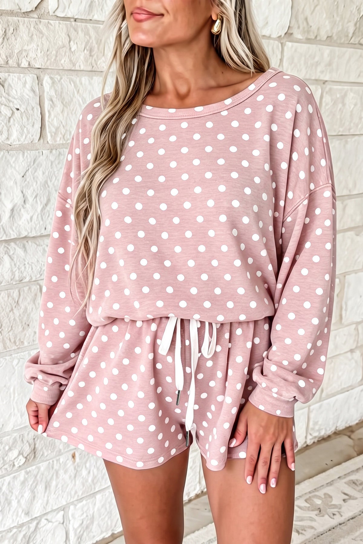Pink polka dot long-sleeve top and matching shorts set from ARVELA